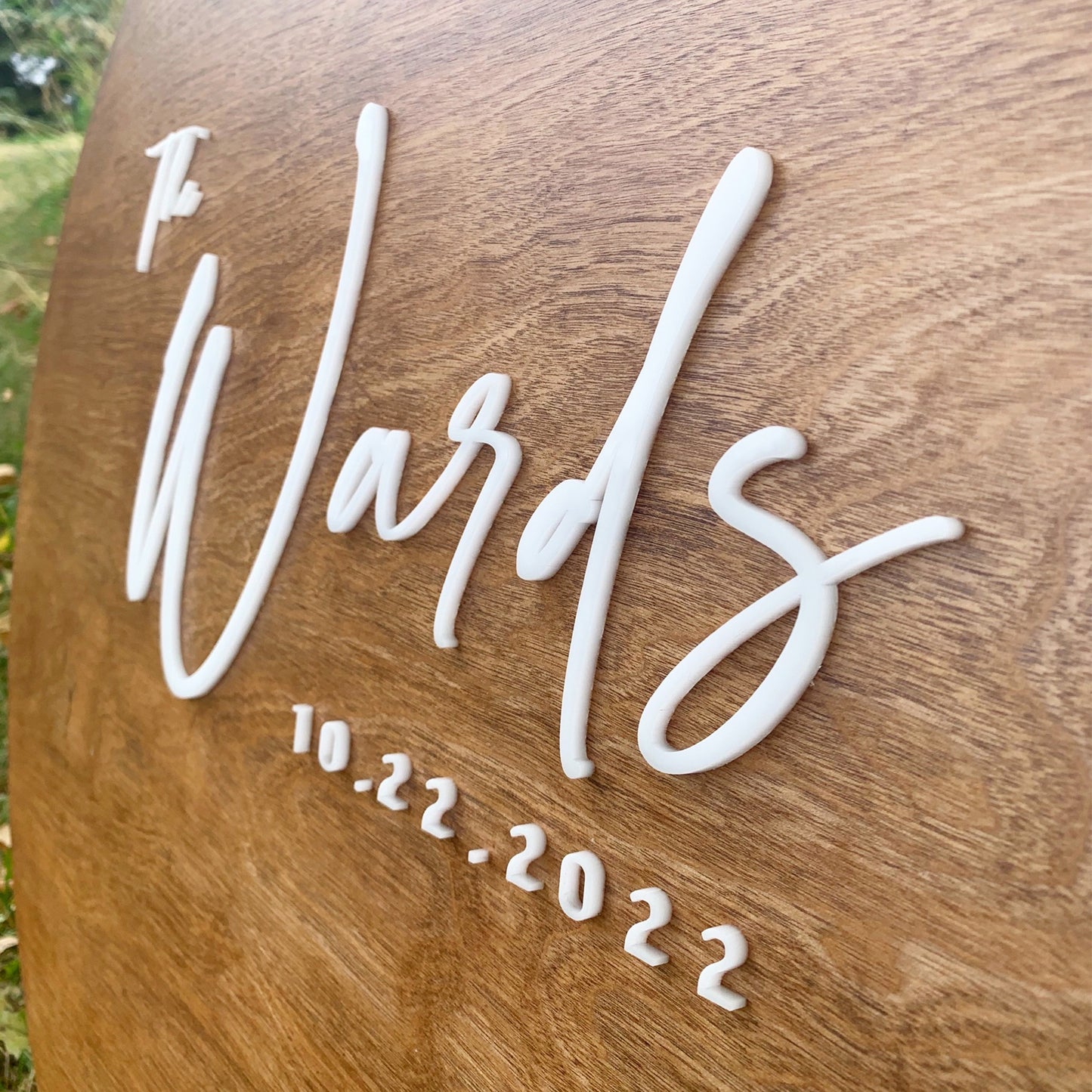 Sample Round Alternative guestbook with walnut stain and white font